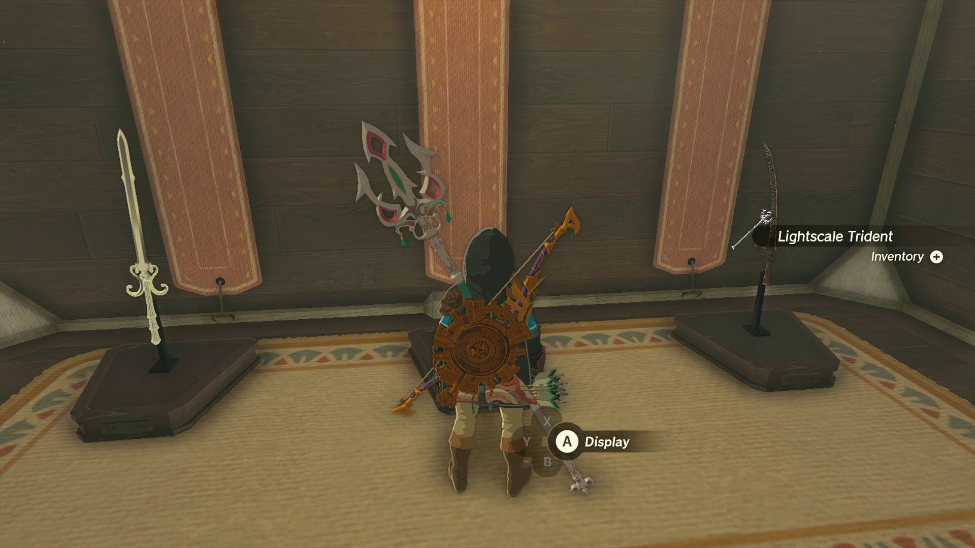 Collecting Sidon's Lightscale Trident from a Weapon Stand